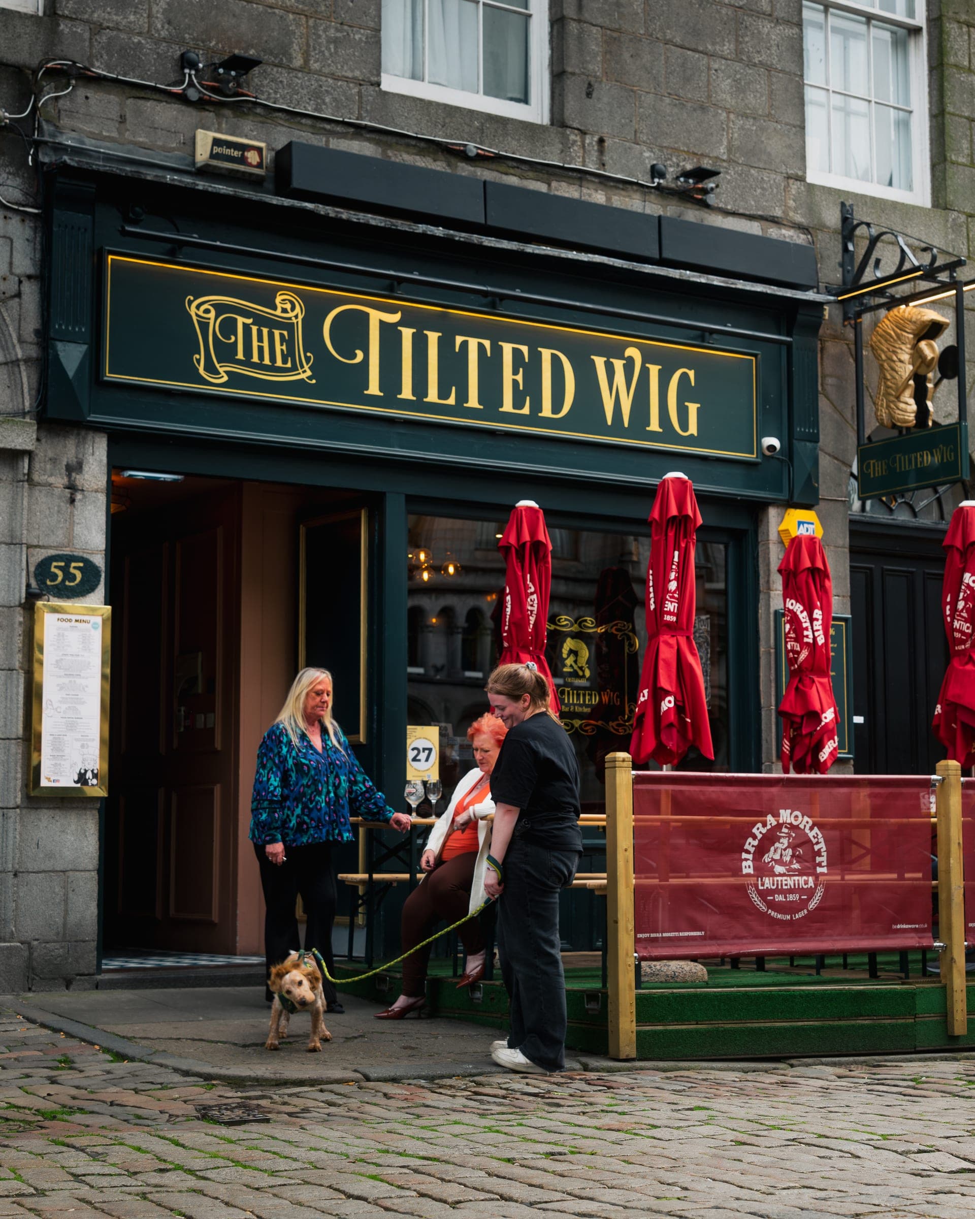 The Tilted Wig with a dog outside - dog-friendly pub in Aberdeen